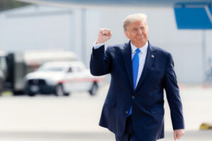 Greenville, S.C., USA - October 15 2020: Donald Trump walking outdoors, raising his fist in a gesture of triumph